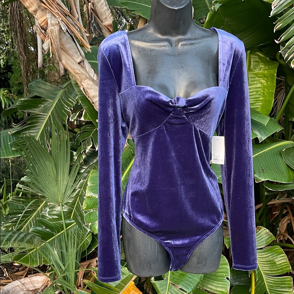 Purple velvet bodysuit.